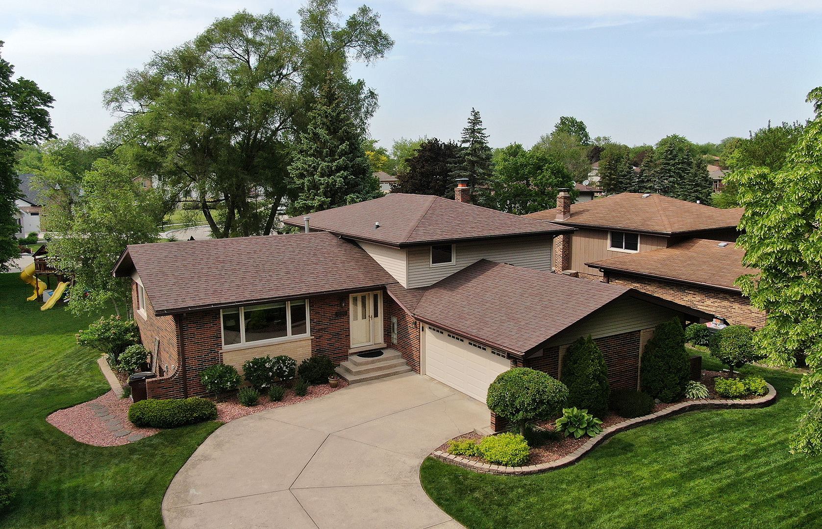 10918 3rd Street Mokena, IL 60448 - Photo 2 of 40 a aerial view of a house with garden and lots of trees