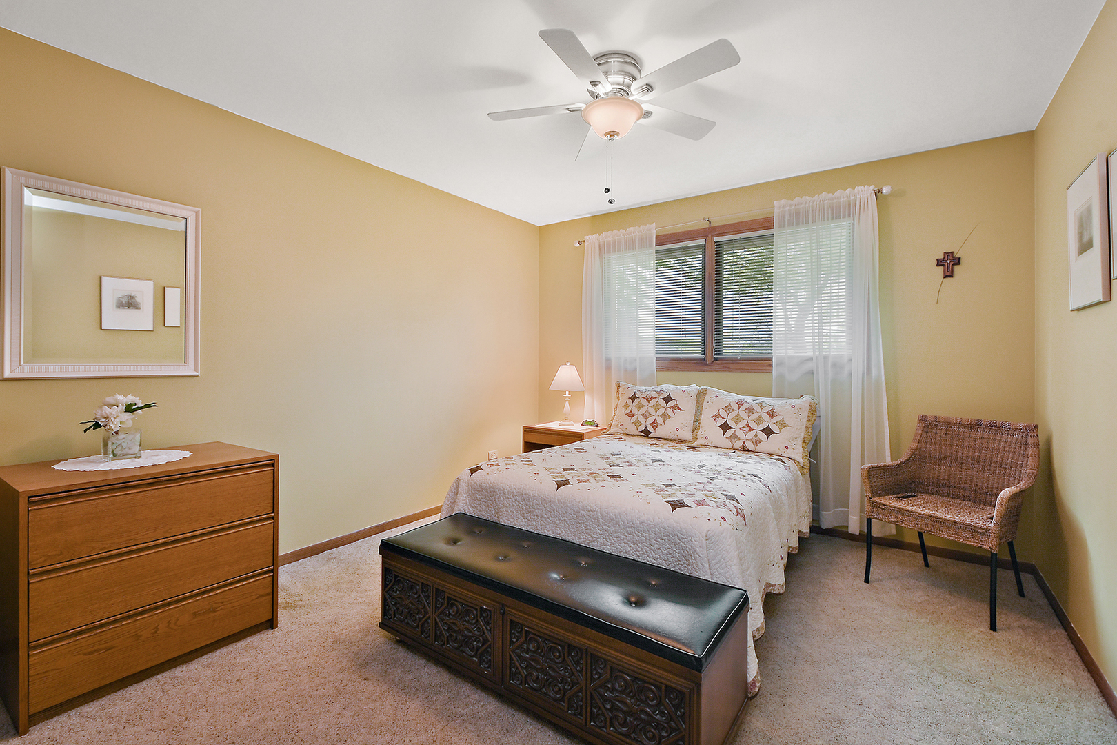 10918 3rd Street Mokena, IL 60448 - Photo 33 of 40 a bedroom with a bed and a chandelier
