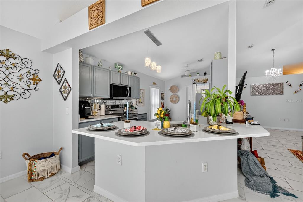2442 Foxhollow Road Tavares, FL 32778 - Photo 12 of 28 a view of a workspace with furniture and flat screen tv