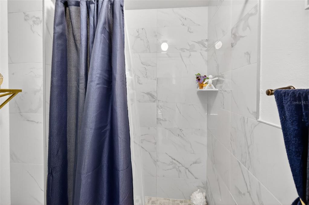 2442 Foxhollow Road Tavares, FL 32778 - Photo 26 of 28 a bathroom with a shower