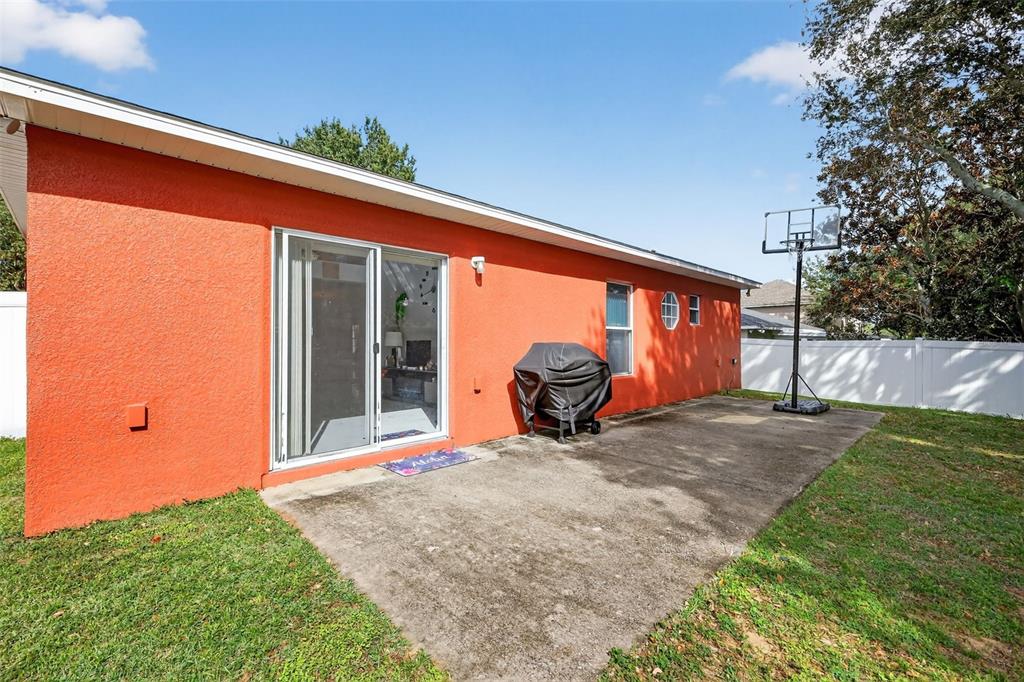 2442 Foxhollow Road Tavares, FL 32778 - Photo 4 of 28 a view of a backyard with a large tree