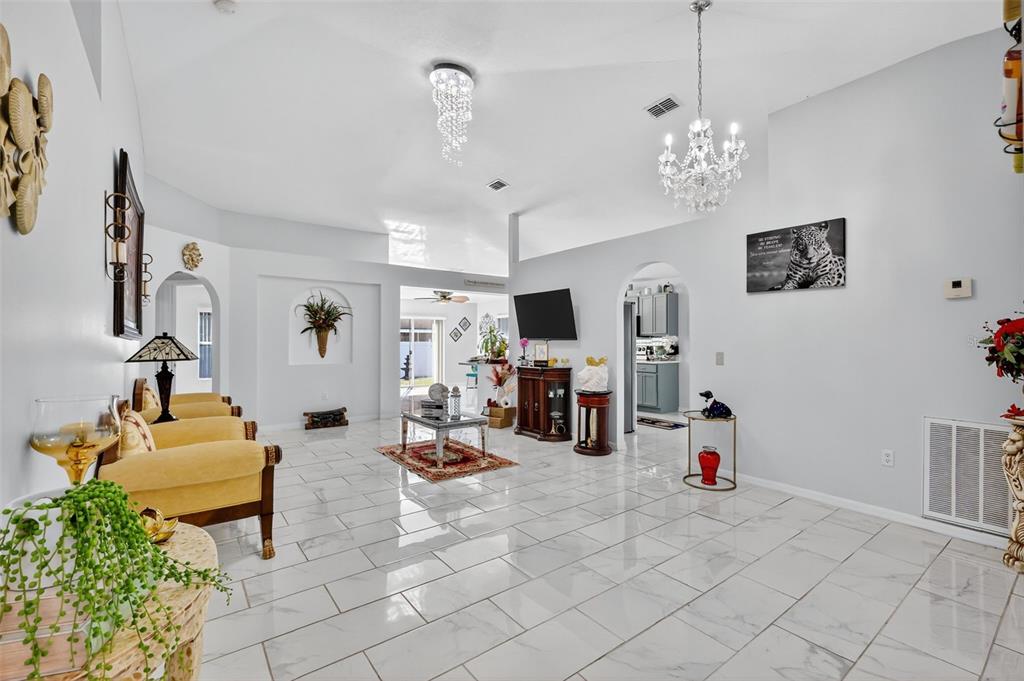 2442 Foxhollow Road Tavares, FL 32778 - Photo 7 of 28 a view of a livingroom with furniture and toys