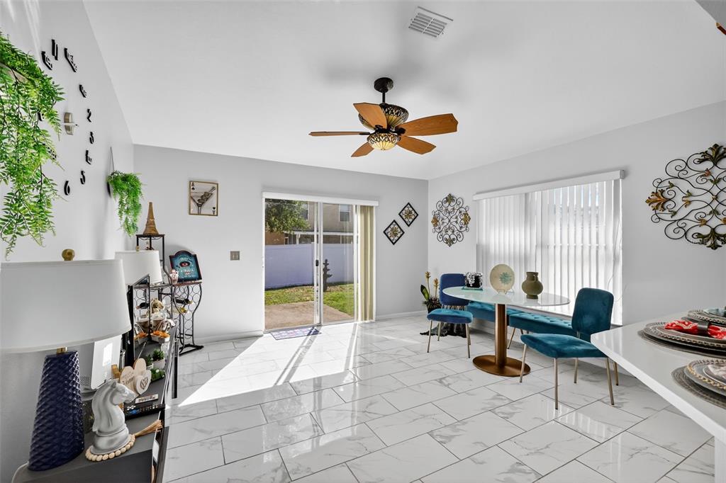 2442 Foxhollow Road Tavares, FL 32778 - Photo 10 of 28 a view of a livingroom with furniture and a window