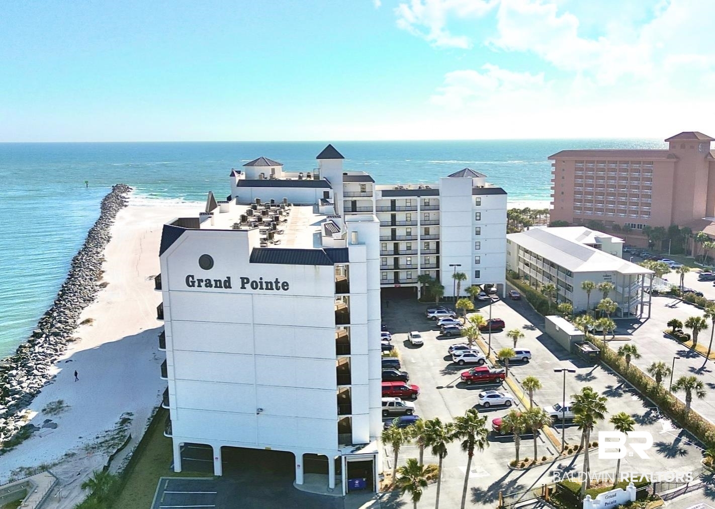 27284 Gulf Road, Unit 212 Orange Beach, AL 36561 - Photo 1 of 35 Aerial view of extended coastline and apartment complex