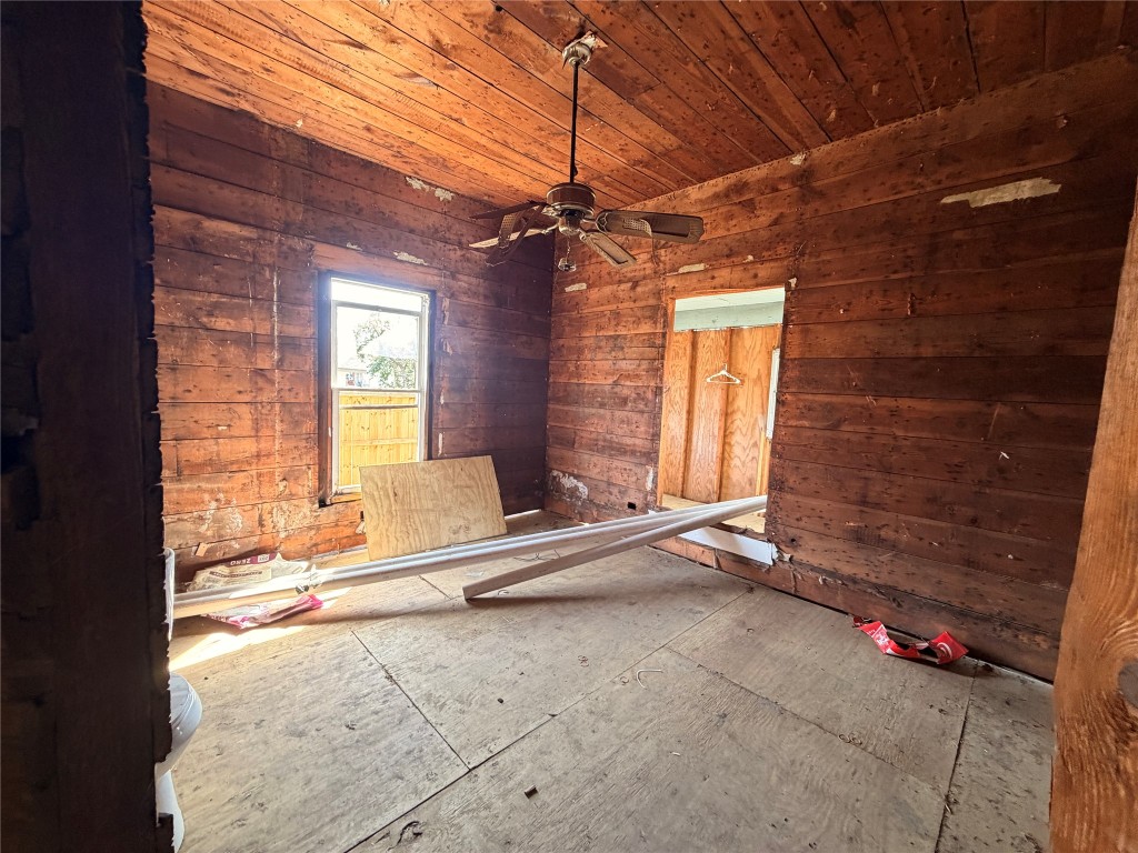 118 Van Molan Street Houston, TX 77022 - Photo 7 of 15 a view of an empty room with a fireplace and a window