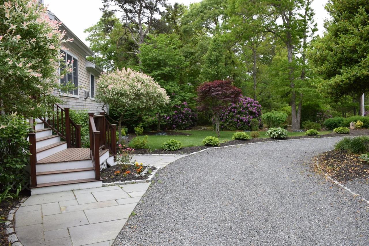 724 Santuit Road Cotuit, MA 02635 - Photo 3 of 35 a view of a park with plants and trees