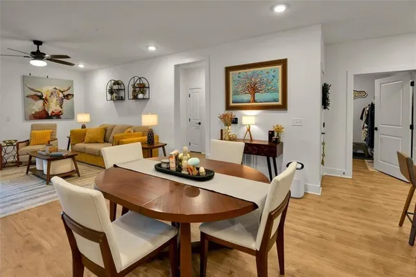 a living room with furniture fireplace and flat screen tv