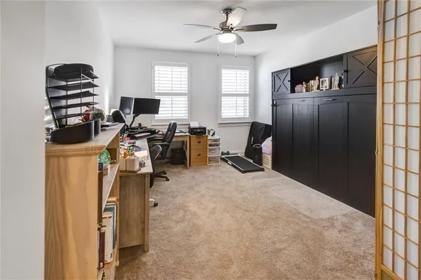 a bedroom with a bed and closet