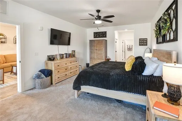 a view of a hallway with closet and wooden floor