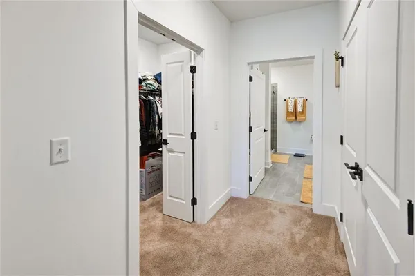 a living room with furniture and a mirror