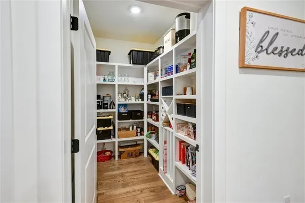 a view of storage and utility room with washer and dryer
