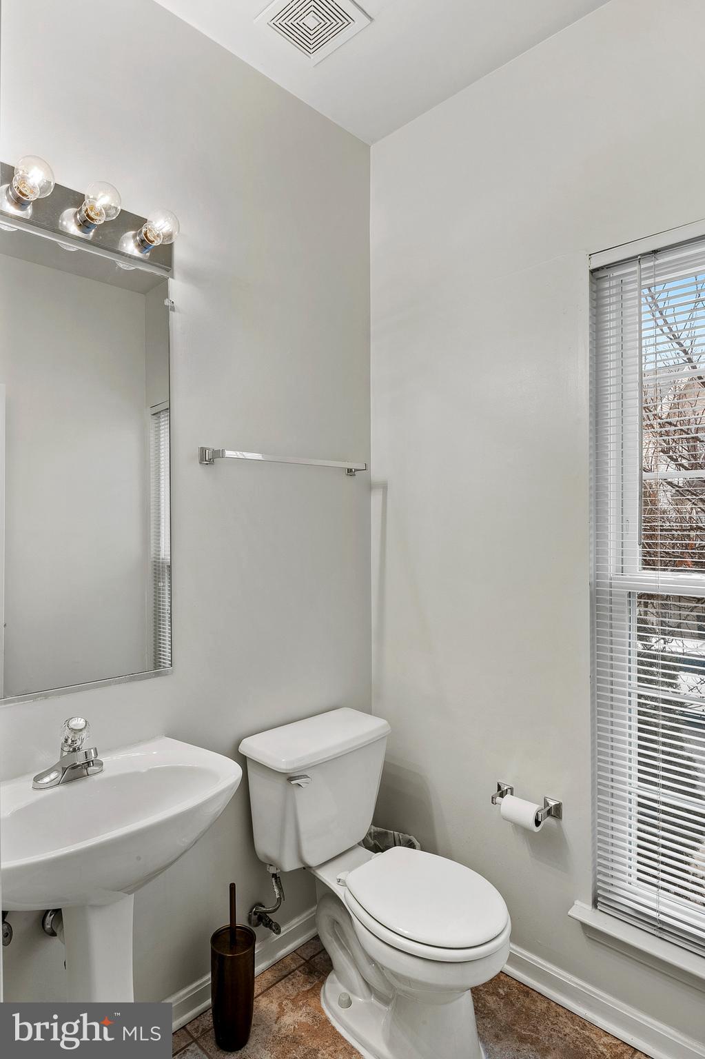 2720 Summers Ridge Drive Odenton, MD 21113 - Photo 14 of 29 a white toilet sitting next to a bathroom sink