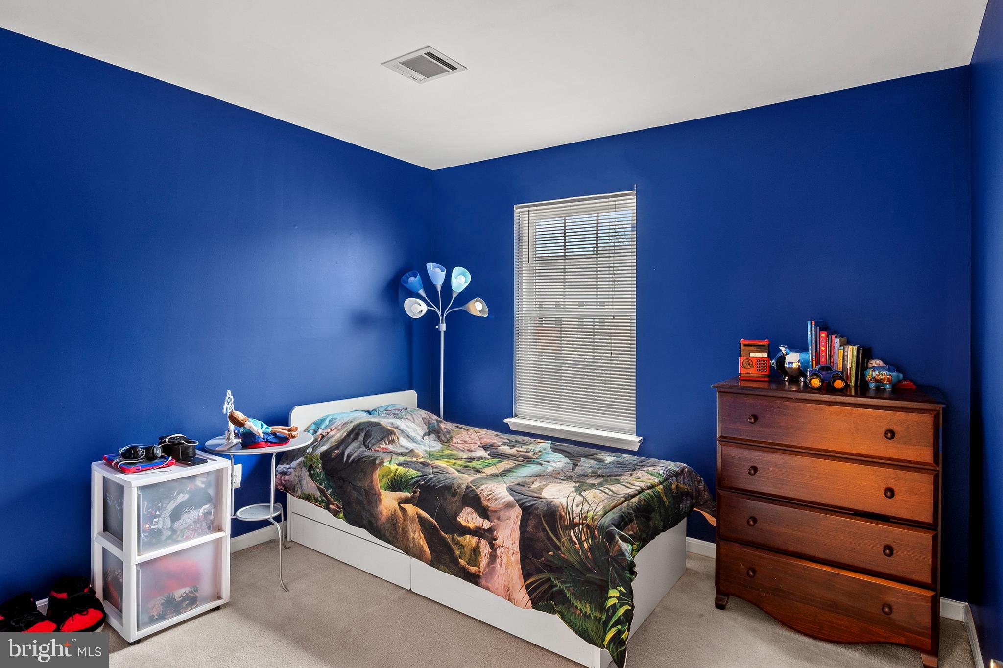 2720 Summers Ridge Drive Odenton, MD 21113 - Photo 19 of 29 a bedroom with a bed and a dresser in it