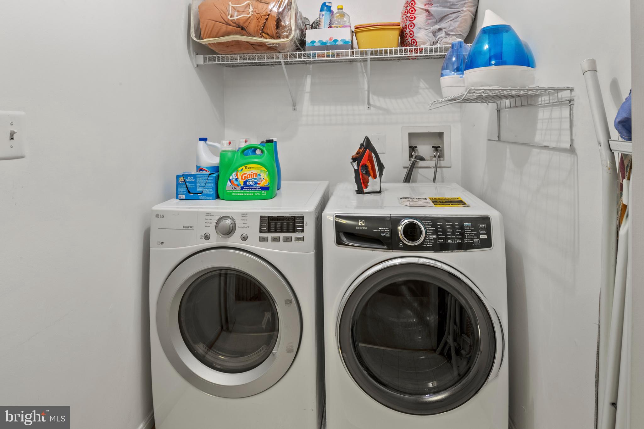 2720 Summers Ridge Drive Odenton, MD 21113 - Photo 22 of 29 a view of storage and utility room with washer and dryer