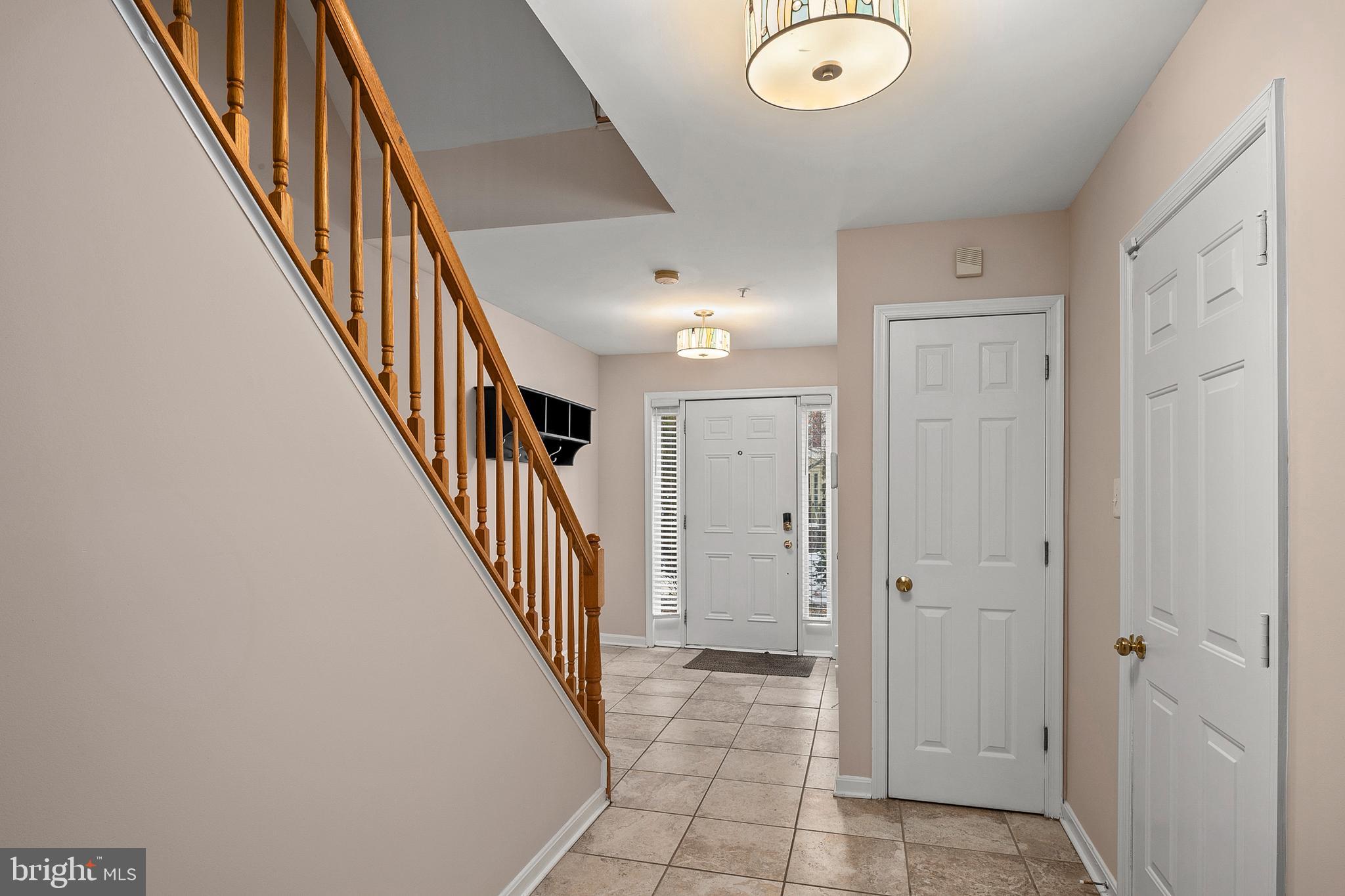 2720 Summers Ridge Drive Odenton, MD 21113 - Photo 5 of 29 a view of a hallway with wooden floor and entryway