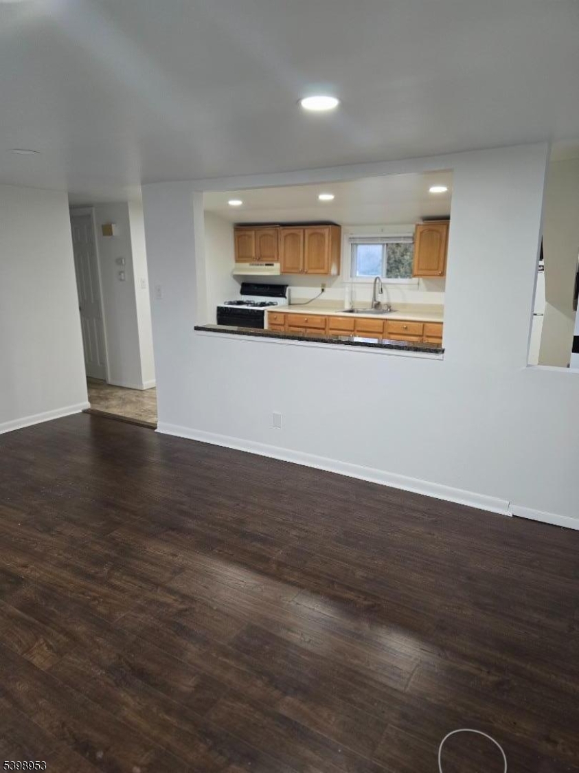 18 Donna Drive, Unit 2 Wood-Ridge, NJ 07075 - Photo 12 of 15 a view of kitchen with wooden floor