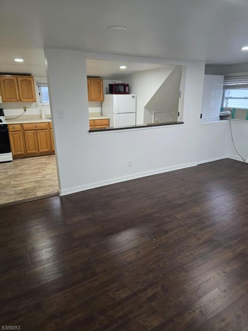 18 Donna Drive, Unit 2 Wood-Ridge, NJ 07075 - Photo 13 of 15 a view of a kitchen with wooden floor and a sink