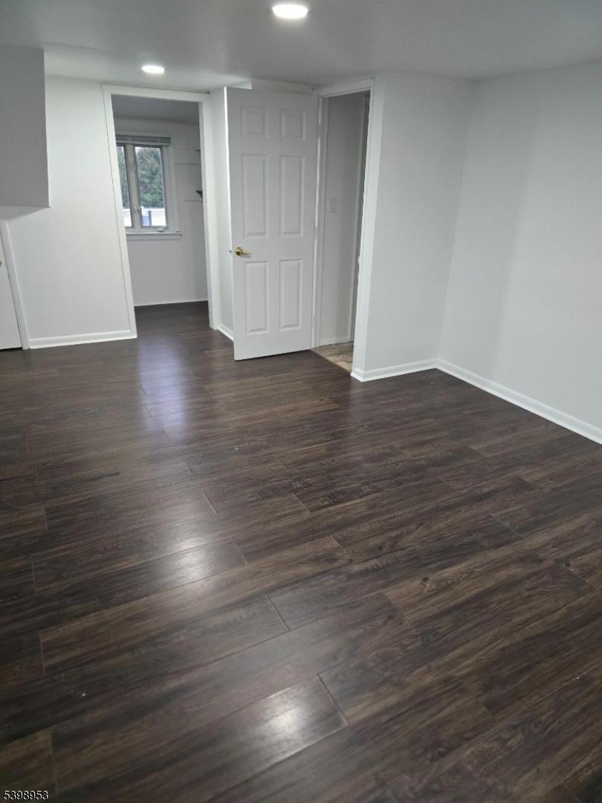 18 Donna Drive, Unit 2 Wood-Ridge, NJ 07075 - Photo 2 of 15 an empty room with wooden floor and windows