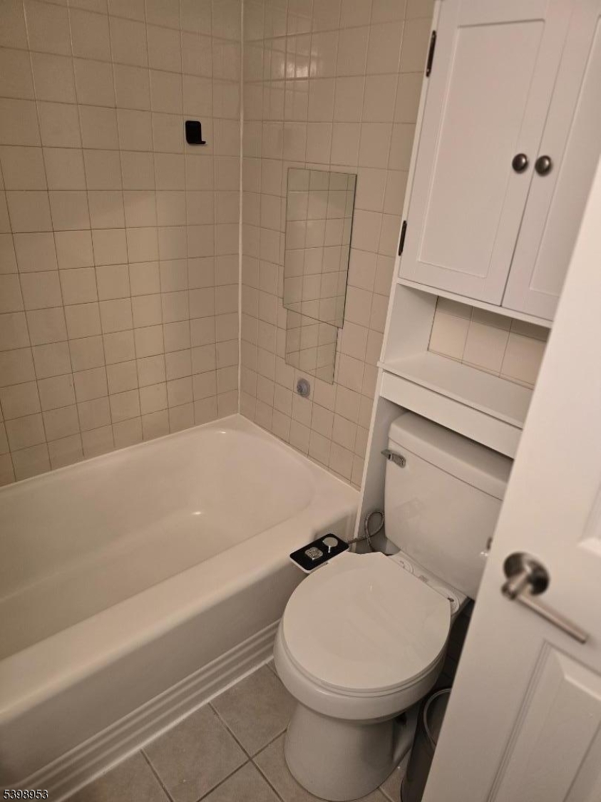 18 Donna Drive, Unit 2 Wood-Ridge, NJ 07075 - Photo 6 of 15 a bathroom with a toilet and shower
