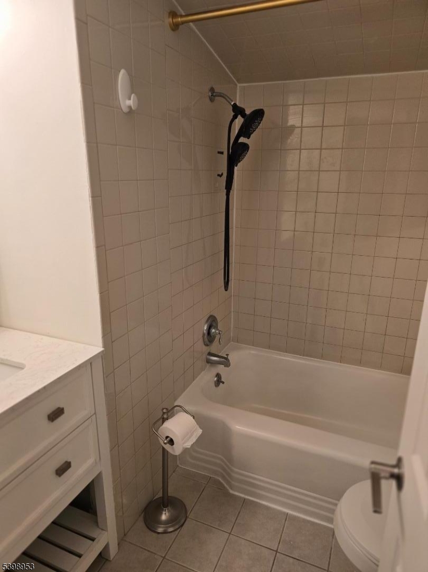 18 Donna Drive, Unit 2 Wood-Ridge, NJ 07075 - Photo 7 of 15 a bathroom with a bathtub and a toilet