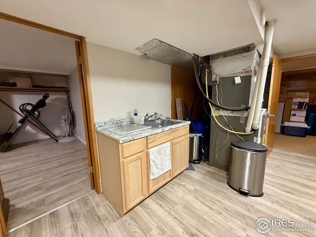 a kitchen with a sink and cabinets