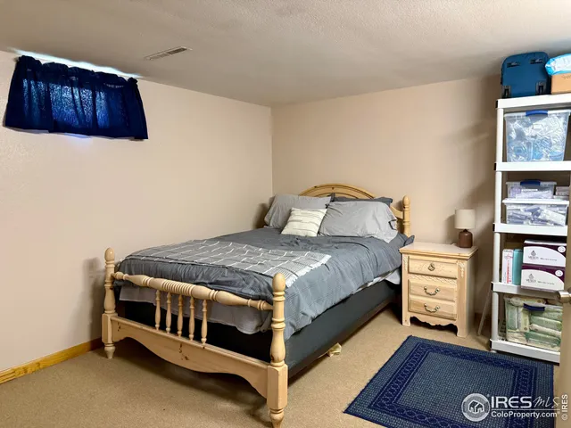 a bedroom with a bed and a cabinets