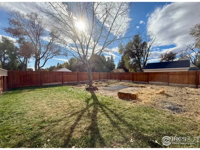 a view of backyard with green space