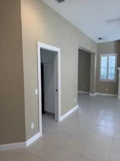a view of a livingroom with a fireplace and window