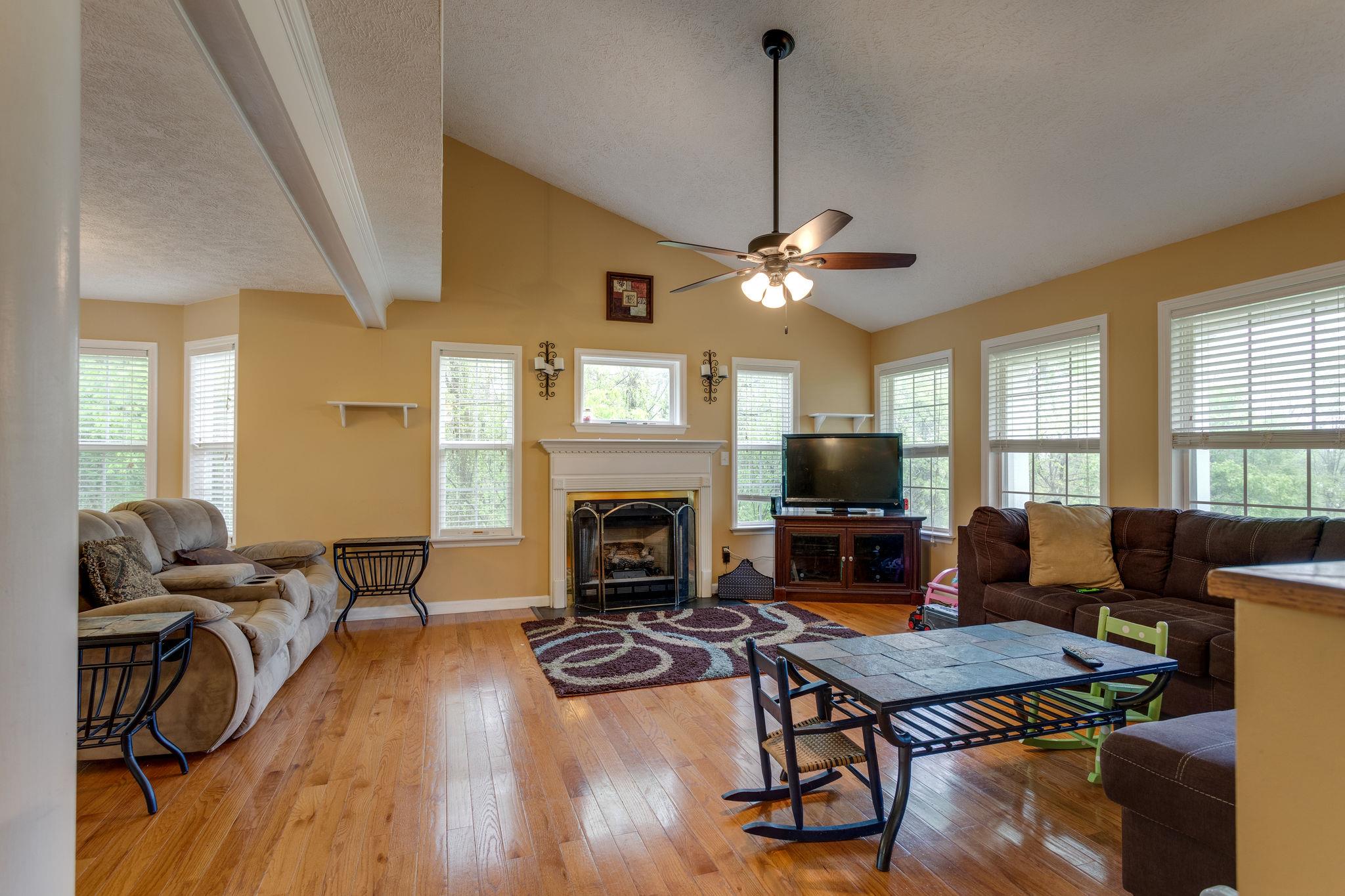 1489 Center Star Road Columbia, TN 38401 - Photo 11 of 27 a living room with furniture fireplace and flat screen tv