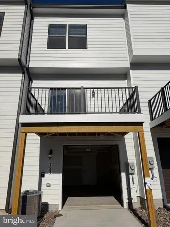 a view of a balcony with furniture