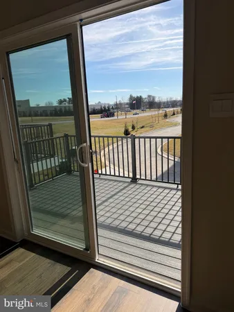 a view of a balcony with wooden floor