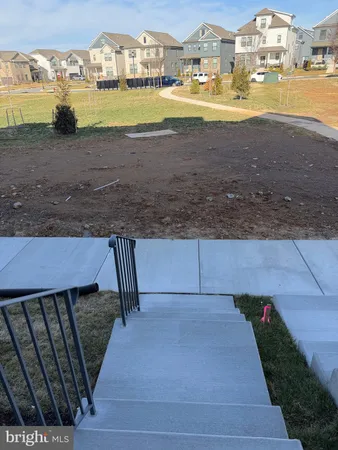 a view of staircase with white walls
