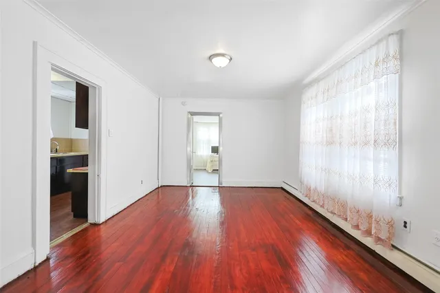 a large kitchen with kitchen island a sink stainless steel appliances and cabinets