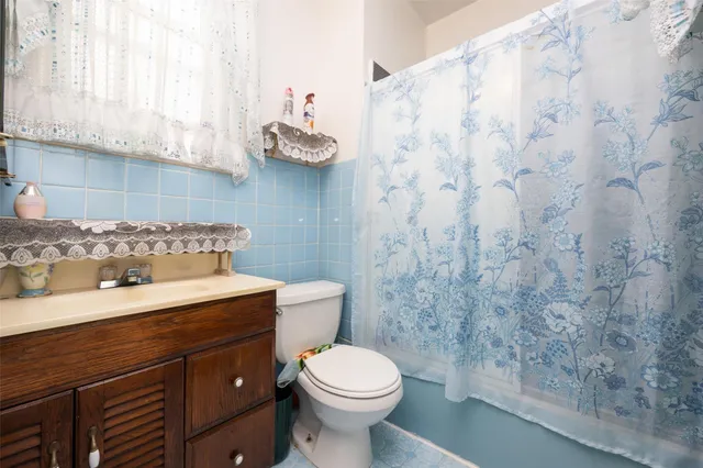 a bathroom with a toilet and a sink