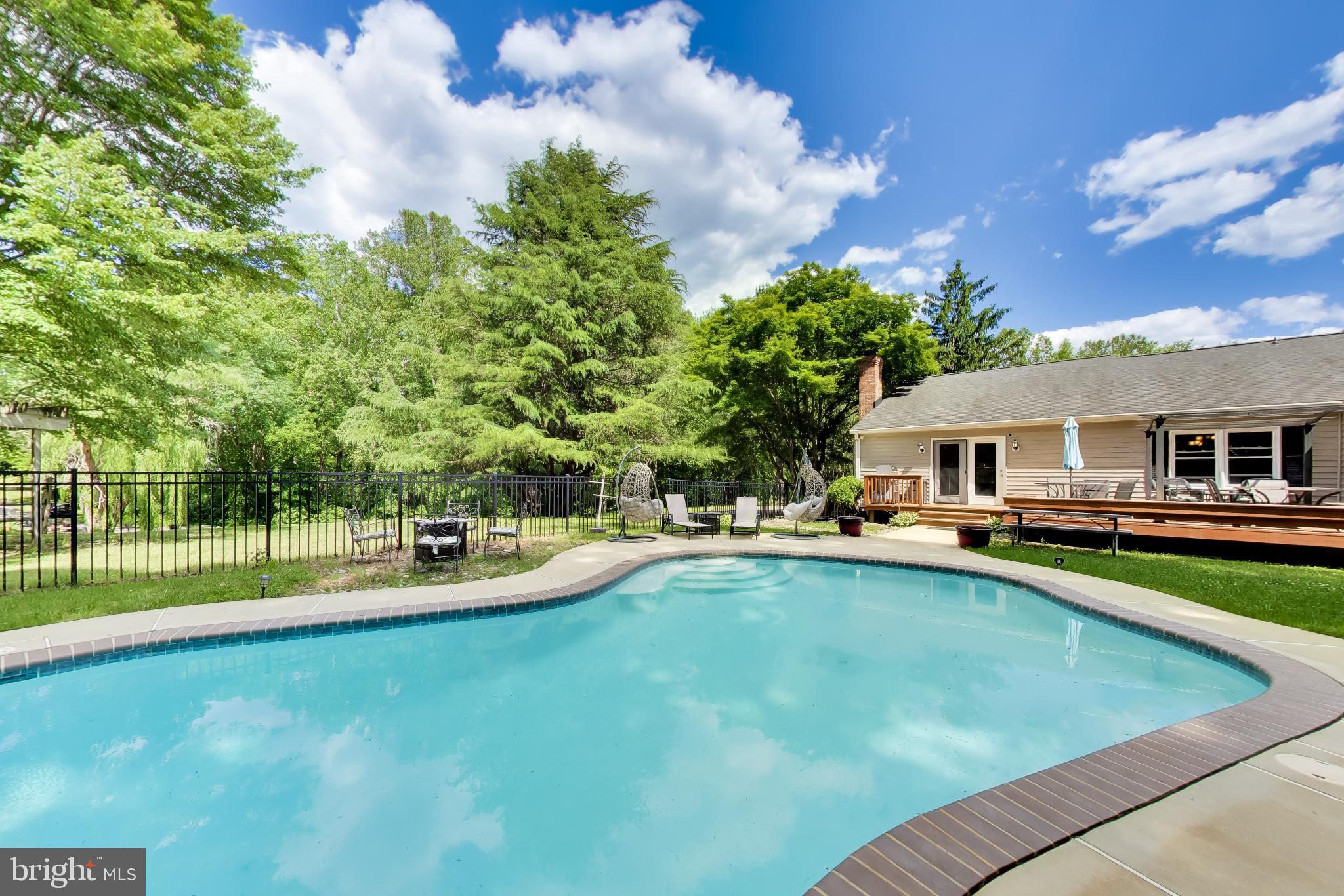 3240 Juniper Lane Huntingtown, MD 20639 - Photo 23 of 48 a view of a house with swimming pool and sitting area
