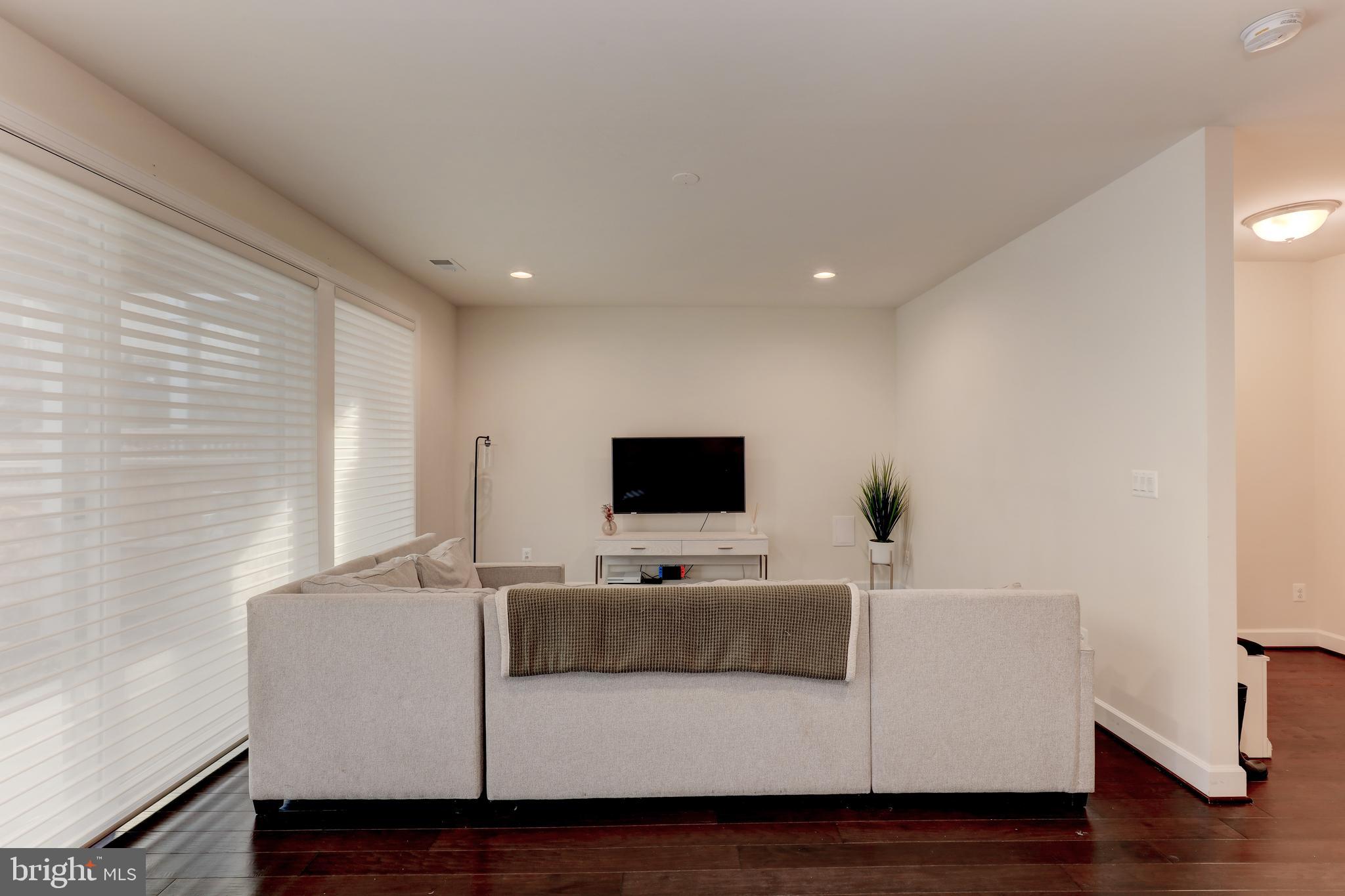 42307 Impervious Terrace Brambleton, VA 20148 - Photo 43 of 54 family room with wall of windows to back yard
