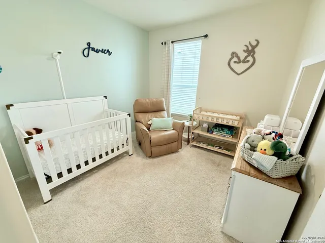 a bedroom with furniture and a bed