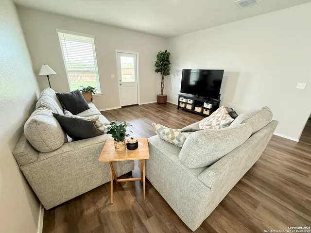 a bedroom with a bed dresser and a window