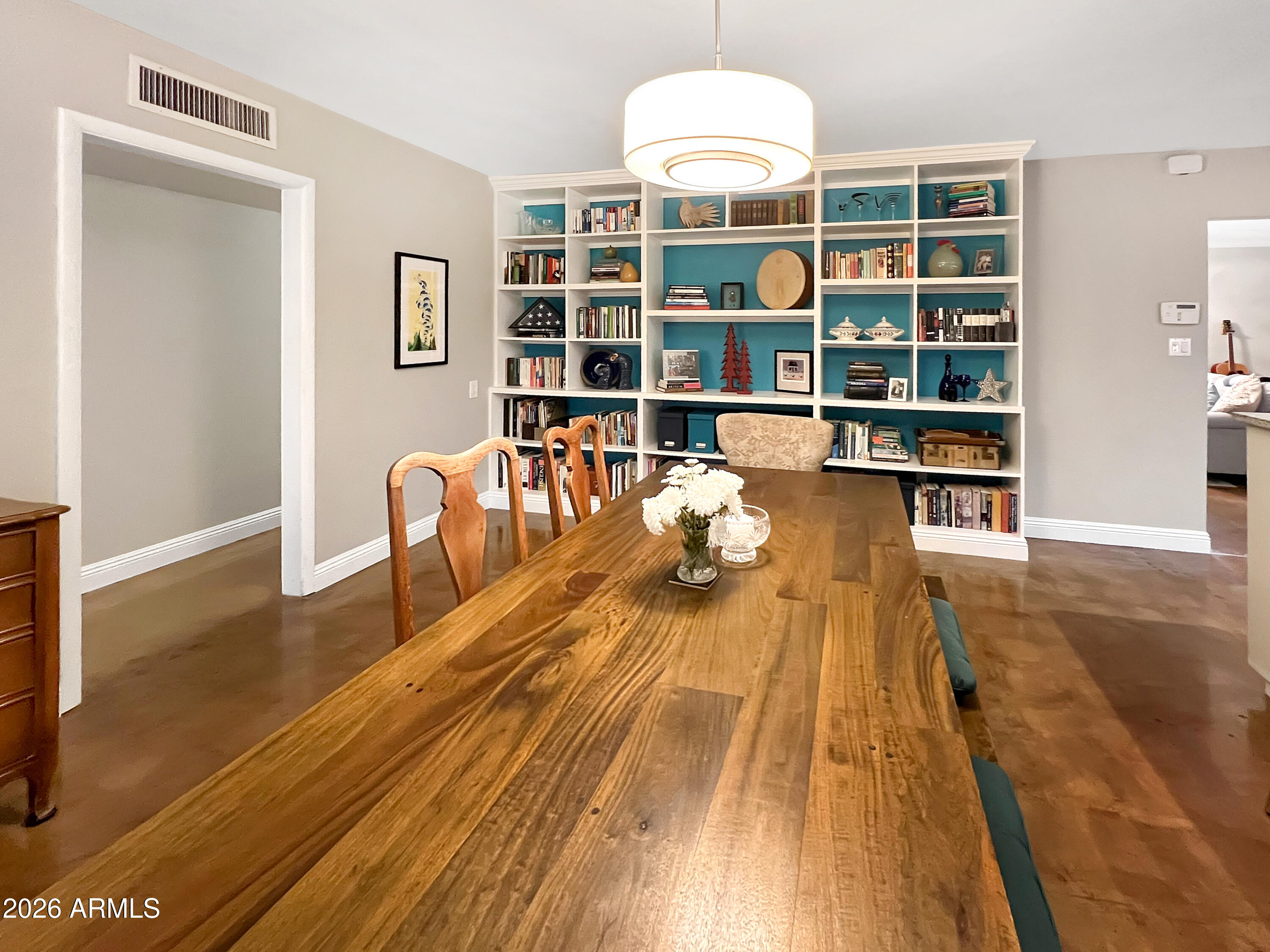 4901 North 82nd Street Scottsdale, AZ 85251 - Photo 14 of 48 a living room with furniture and a book shelf