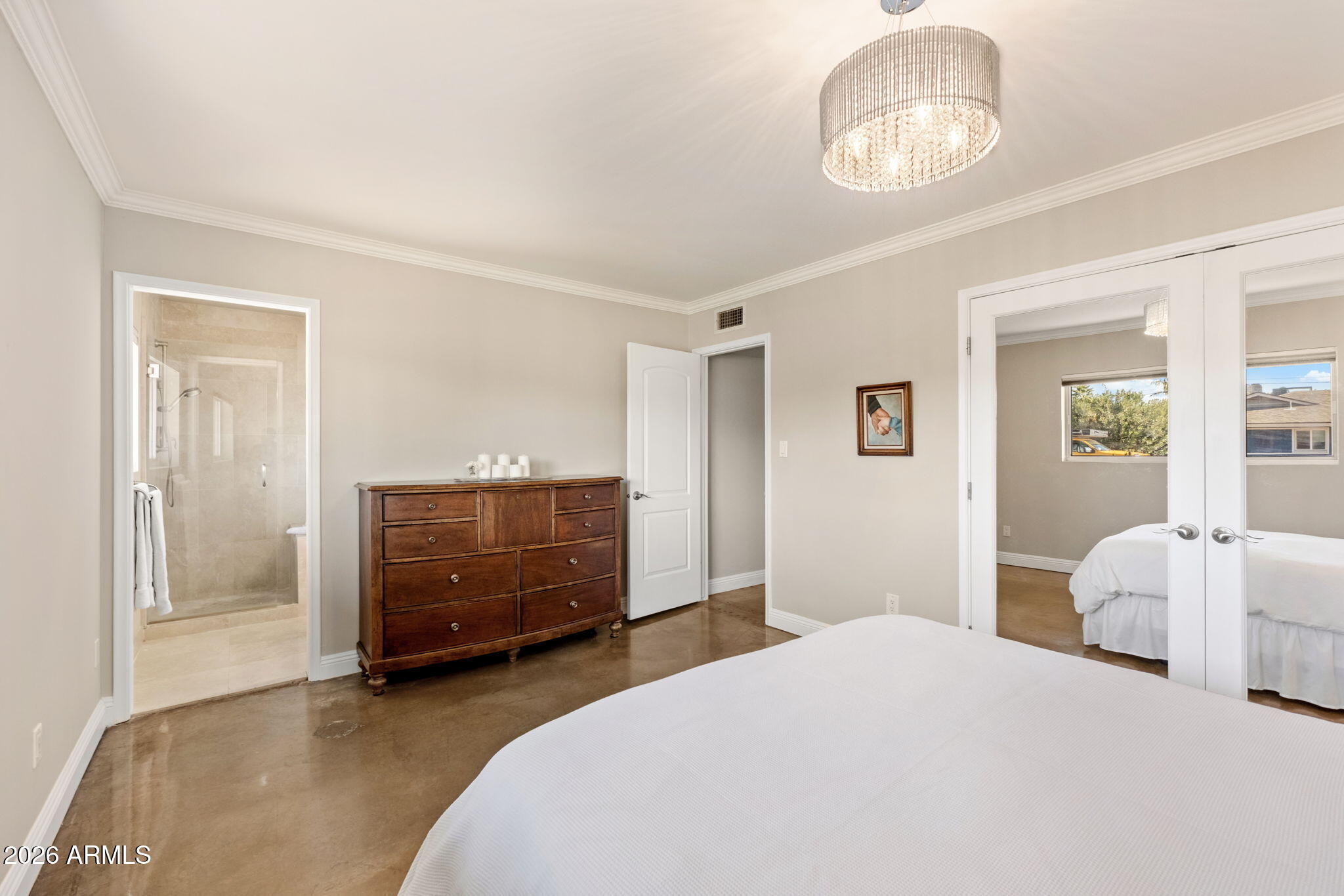 4901 North 82nd Street Scottsdale, AZ 85251 - Photo 22 of 48 a bedroom with a bed and wooden floor