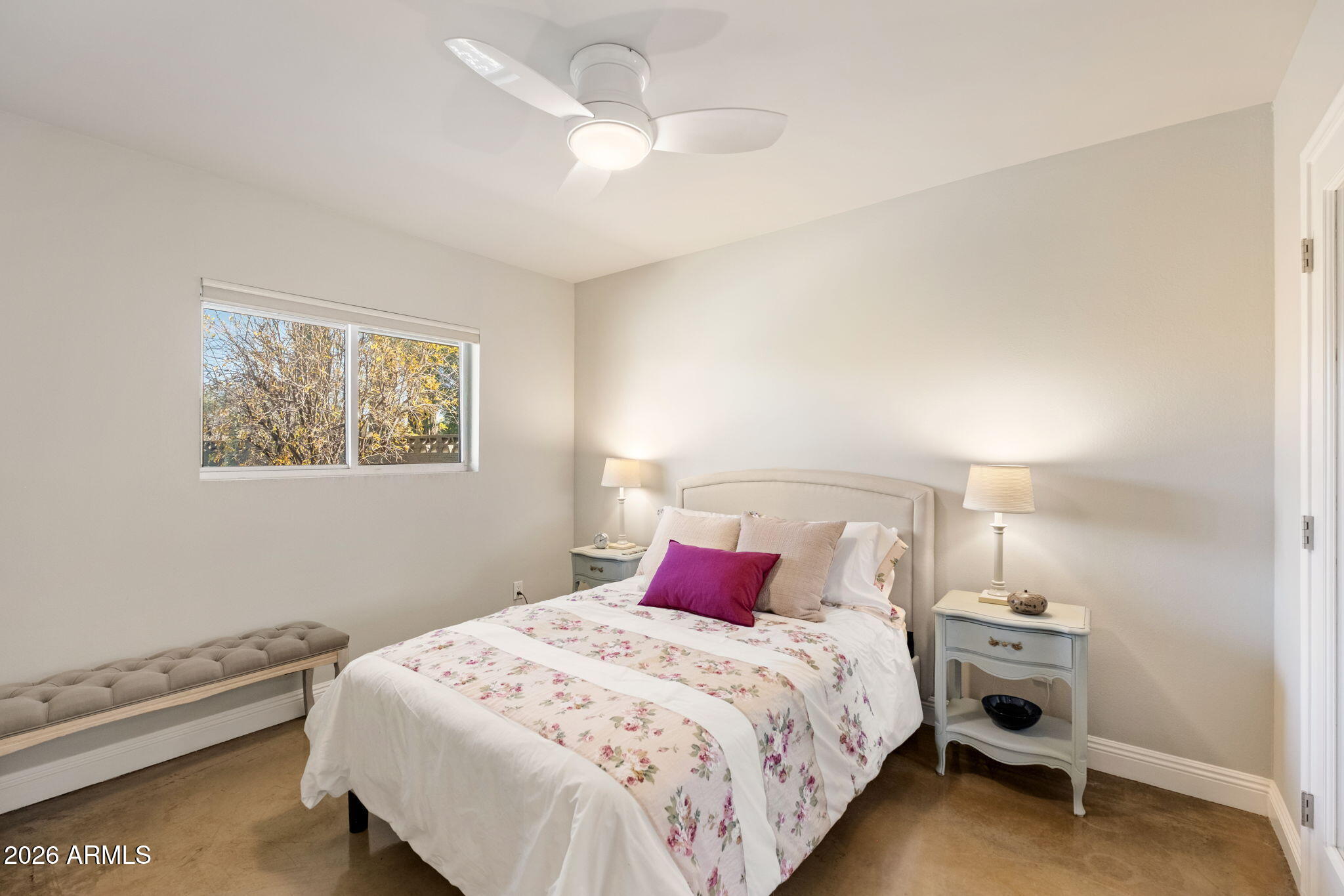 4901 North 82nd Street Scottsdale, AZ 85251 - Photo 25 of 48 a bedroom with a bed and a chandelier