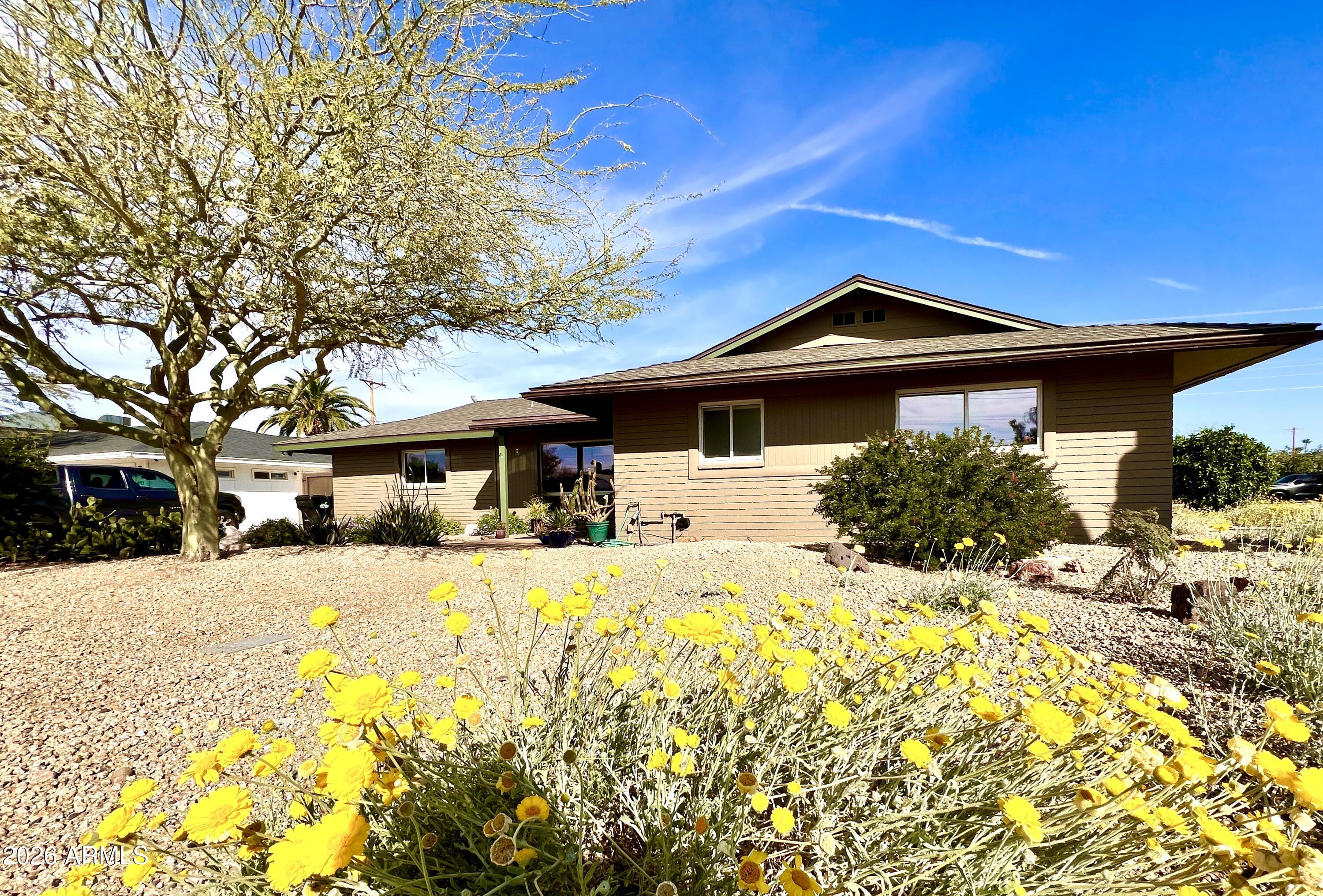 4901 North 82nd Street Scottsdale, AZ 85251 - Photo 47 of 48 a front view of a house with a yard