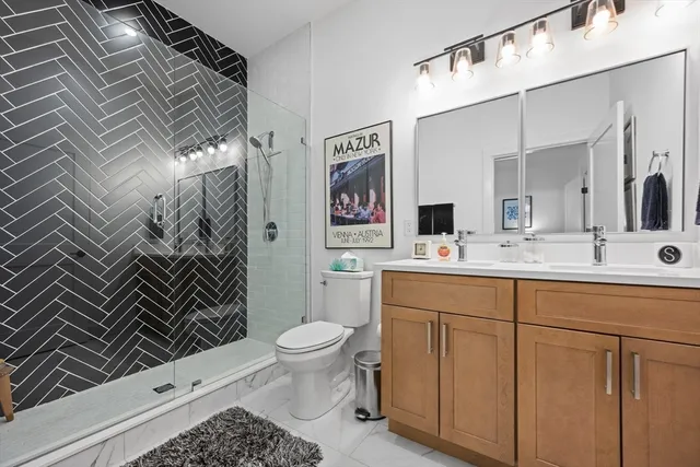 a bathroom with a sink toilet and shower