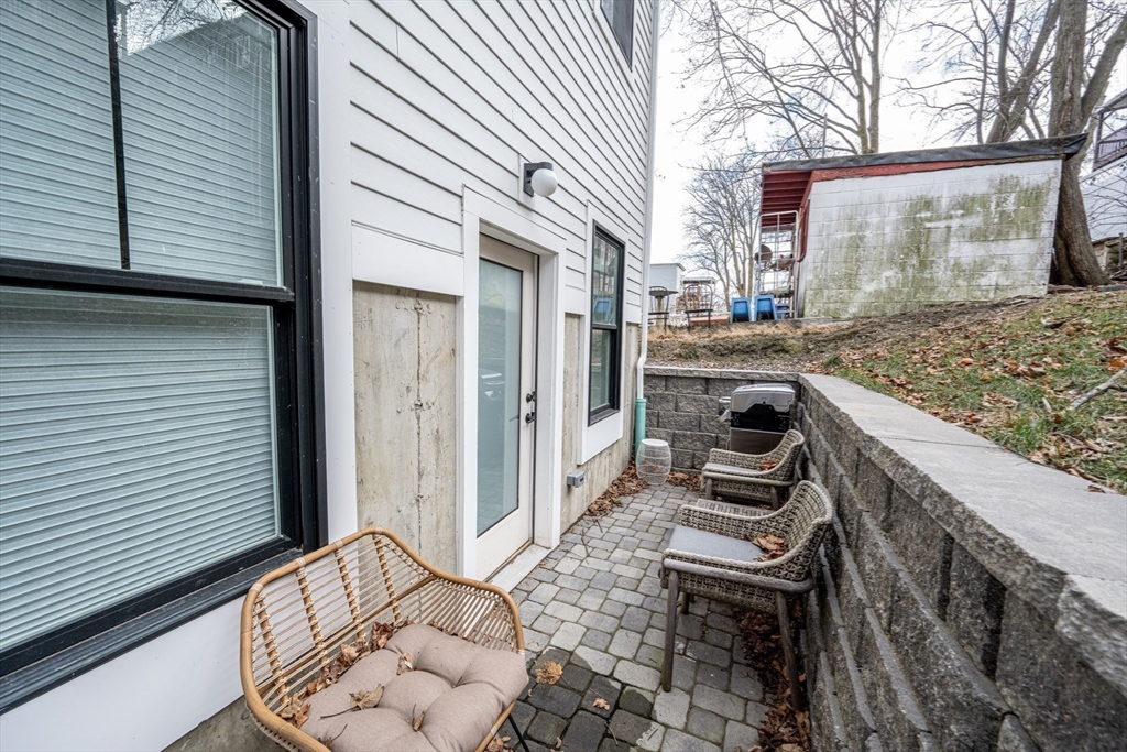 231 Everett Street, Unit 1 Boston, MA 02128 - Photo 29 of 39 a view of a porch with furniture and floor to ceiling window