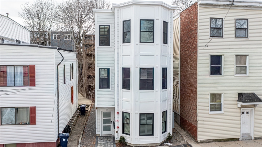 231 Everett Street, Unit 1 Boston, MA 02128 - Photo 3 of 39 a view of a building with a barbeque