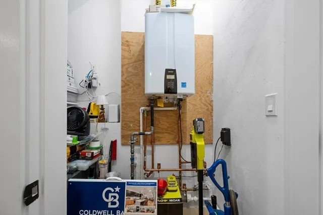 walk in closet with clothes and shoes