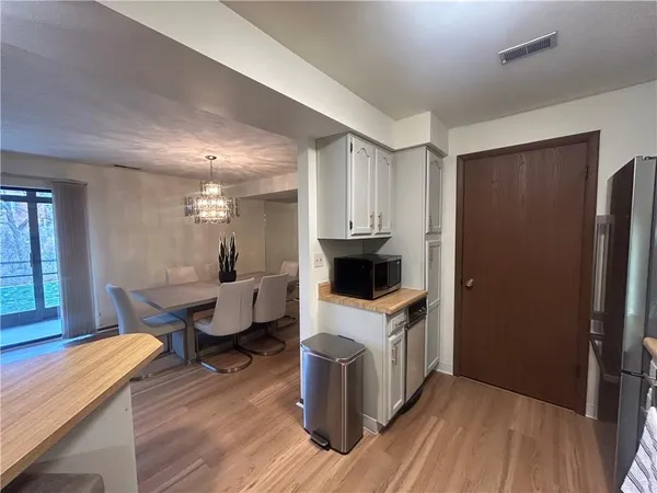a kitchen with a sink appliances and cabinets