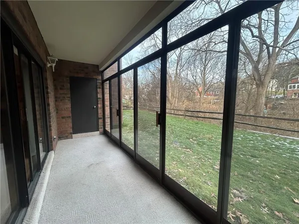 a view of hallway with a large window