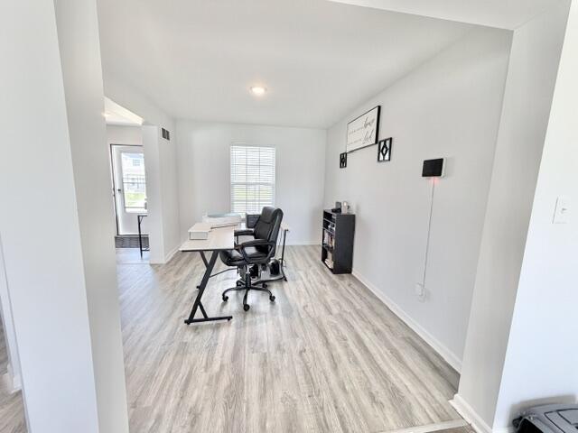 7480 Williams Street Merrillville, IN 46410 - Photo 11 of 49 a view of a livingroom with furniture and wooden floor