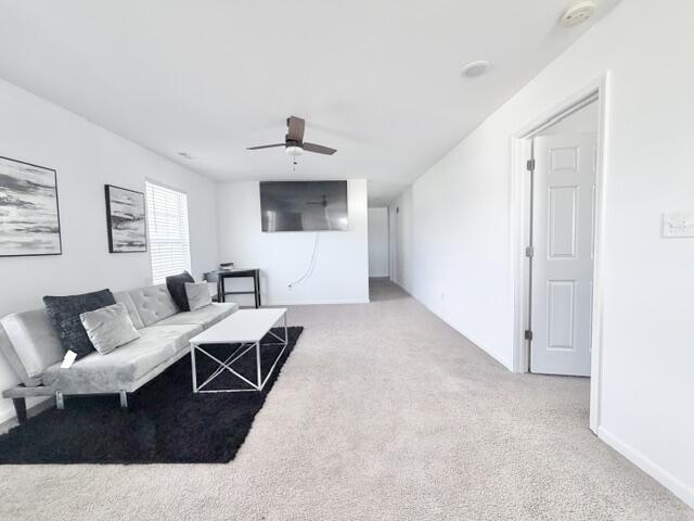 7480 Williams Street Merrillville, IN 46410 - Photo 25 of 49 a living room with furniture and a flat screen tv